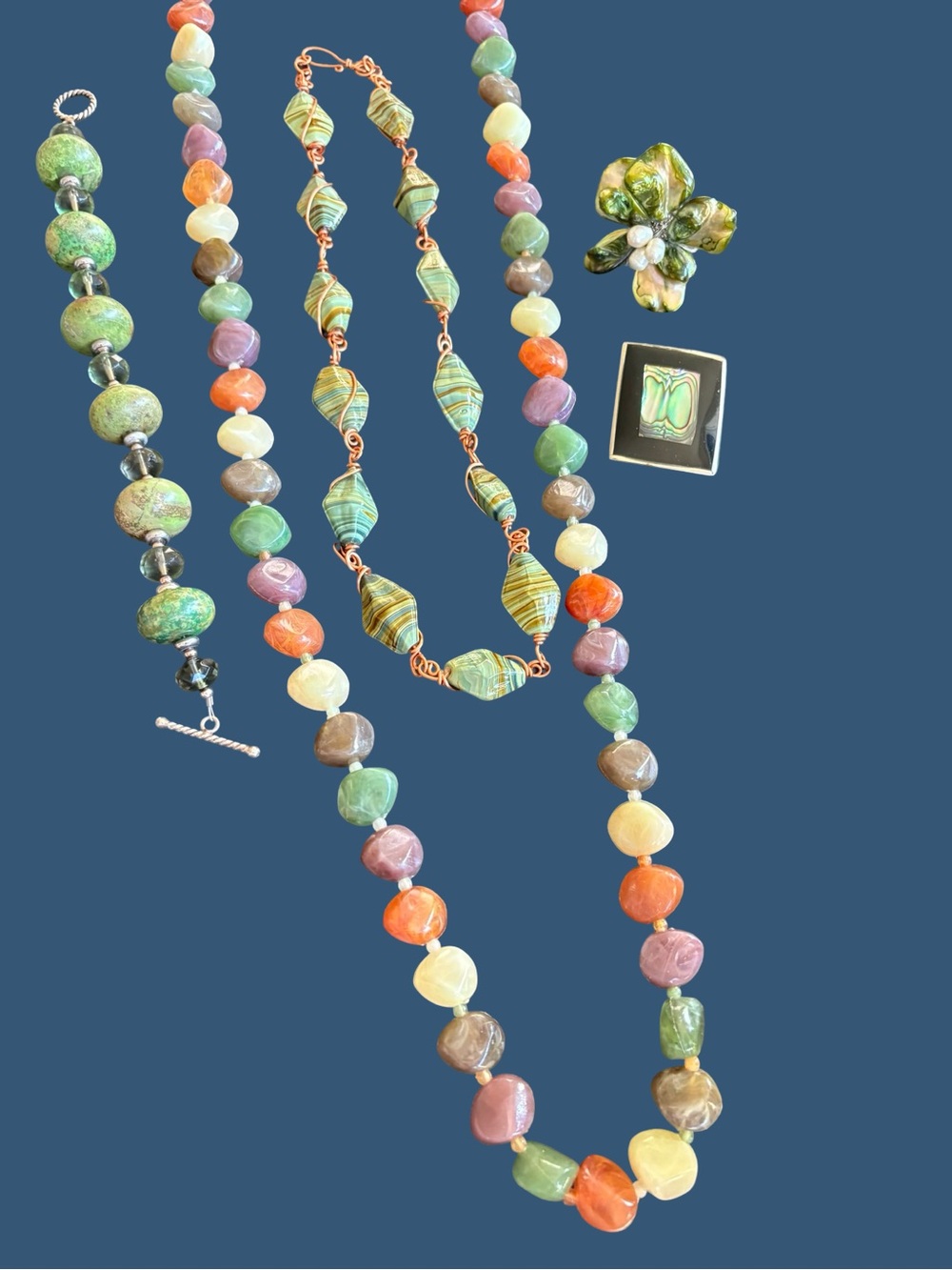 Multicolor Bead Necklaces, green bracelet, alpaca mexico brooch, green ring.
